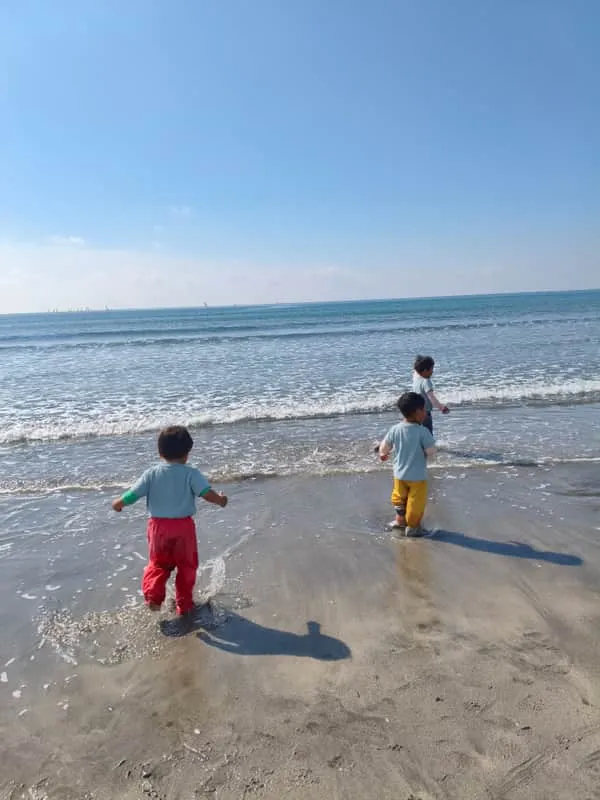 Children playing in the ocean waves